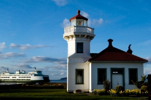 The Point Elliott lighthouse in Mukilteo, with a Washington State Ferry visible in the background.
